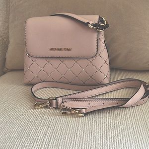 Small leather party bag which can be converted to a crossbody.